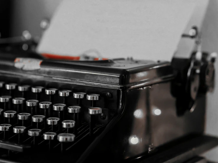 a close up of a typewriter that is open