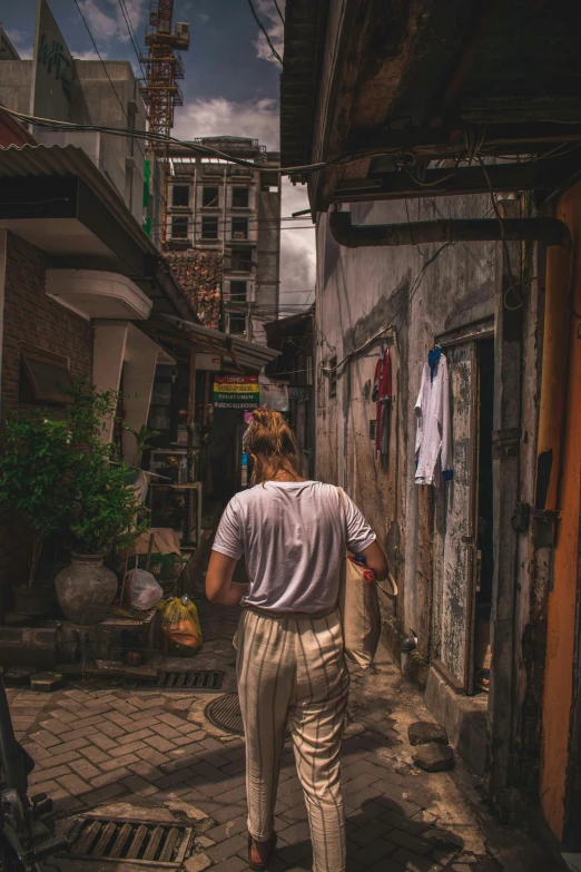 a person that is walking down a street