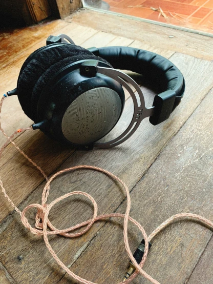 a pair of headphones sitting on top of a floor