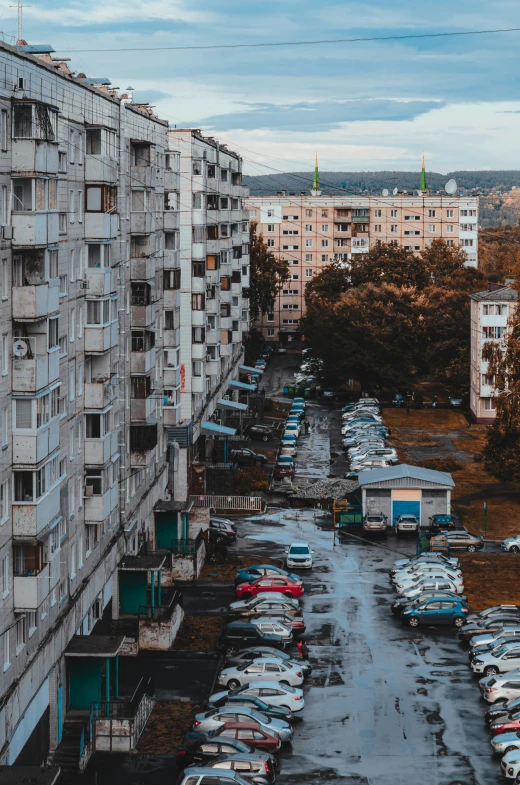 a parking lot filled with lots of parked cars