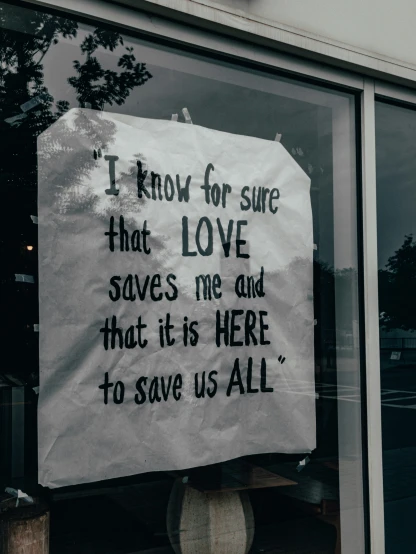 a sign attached to the front window of a restaurant