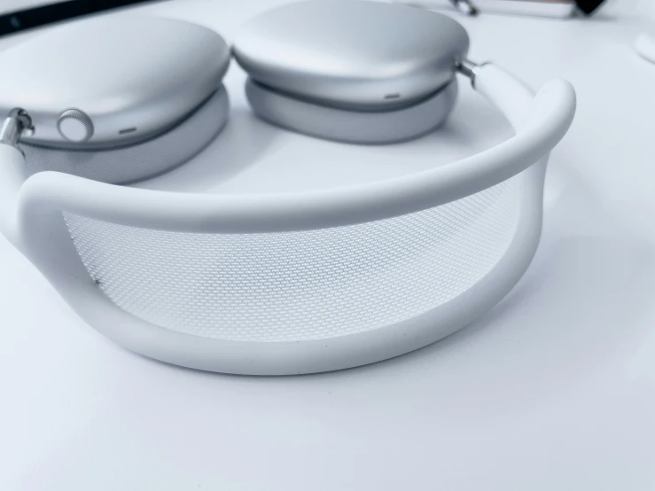 a couple of white controllers sitting on top of a table