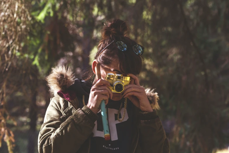 a woman taking a pograph with her camera