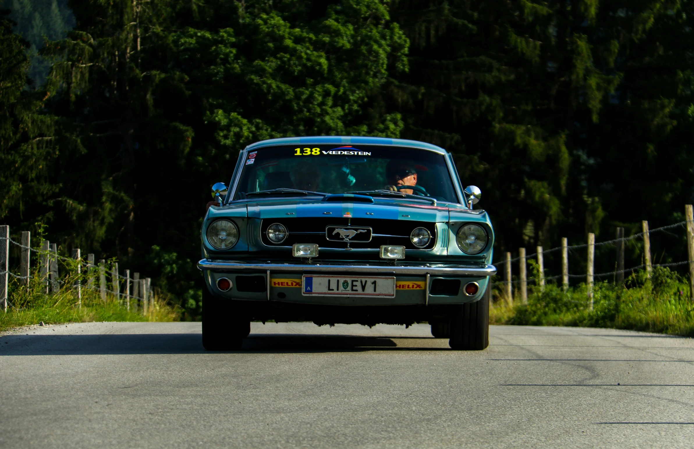 a truck with the number 11 on it drives down a country road