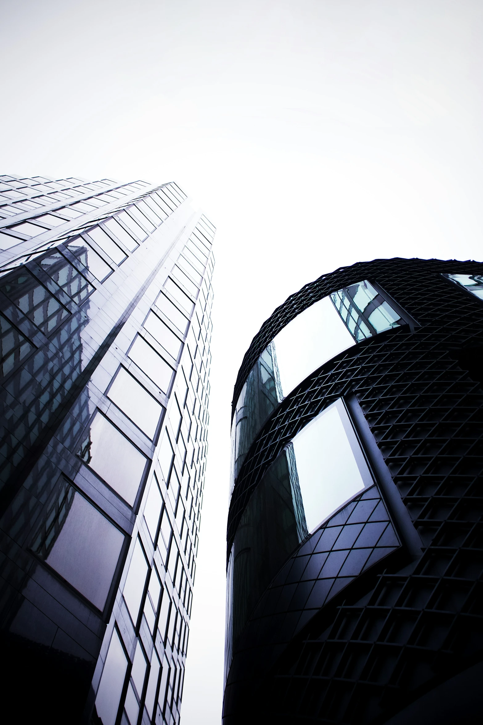 two tall buildings that have been looking up at the sky