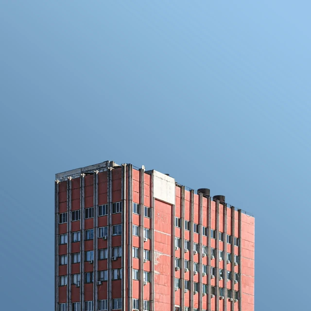 a tall brick building with balconies on it's sides