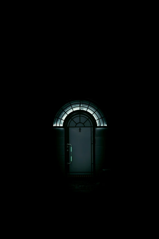 a doorway with some glowing lights in the dark