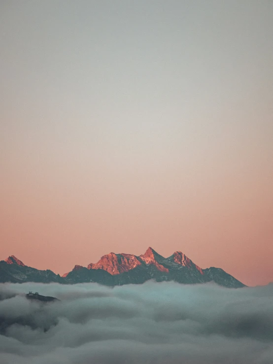 mountains with low lying clouds in the foreground