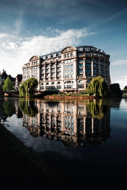 a building and surrounding a body of water