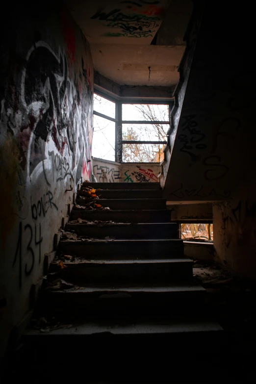 a bunch of stairs in an old rundown building