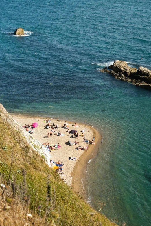 there are people lounging on the beach