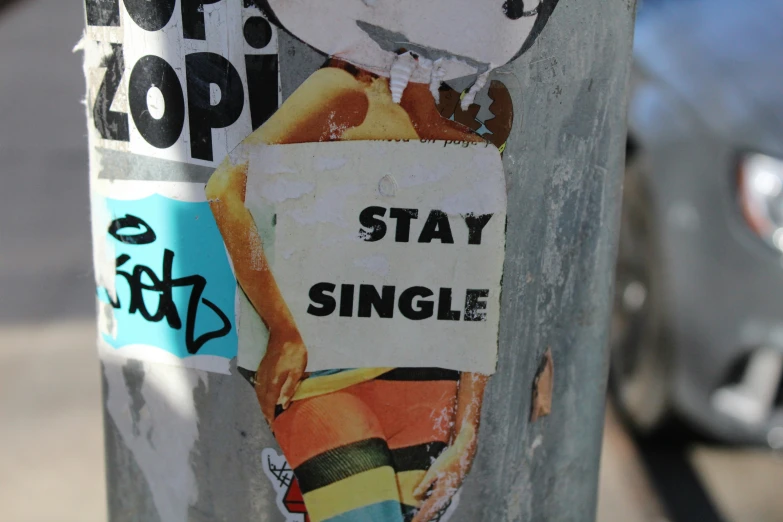 the sticker on this pole reads stay single