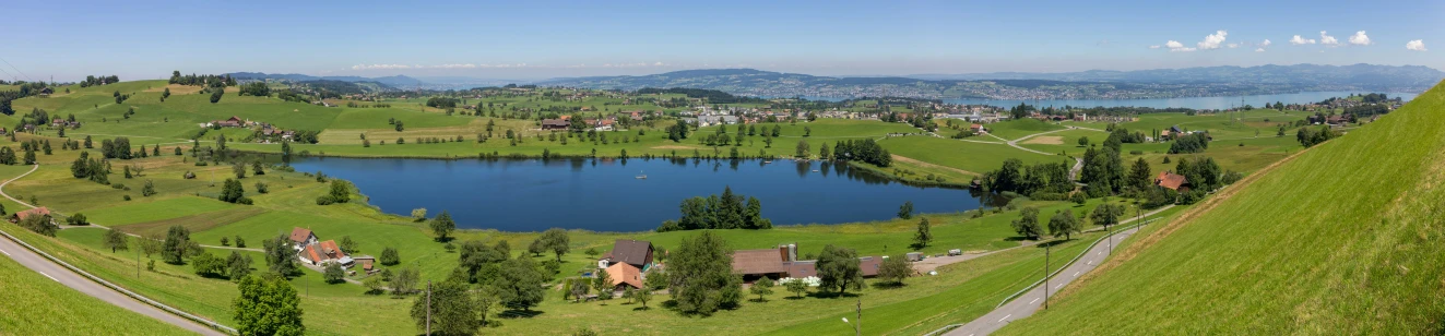 beautiful green countryside and a lake near by