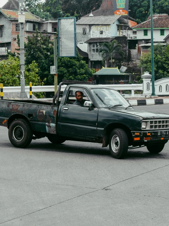 a truck sitting in the middle of the road