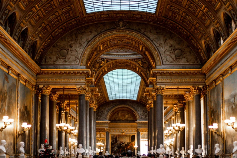 large hall with many statues, and a glass skylight