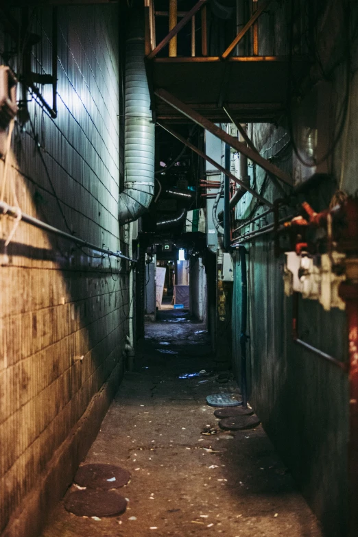 an empty alley with people walking in it