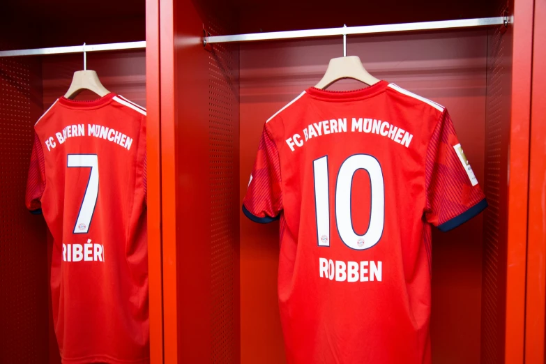 the uniforms of the players from the soccer team of fc have been hung on lockers