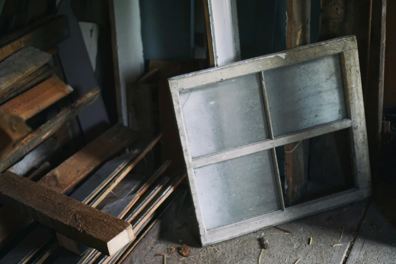 three panes of window sitting on top of a floor