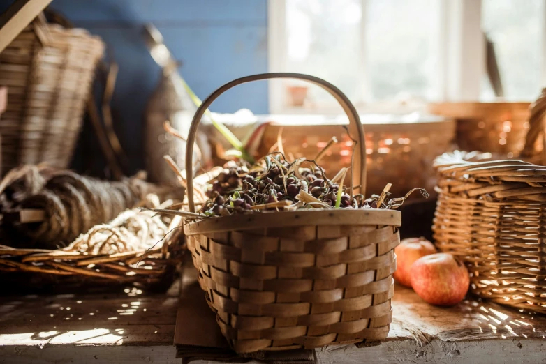 a basket and other baskets are stacked on a floor