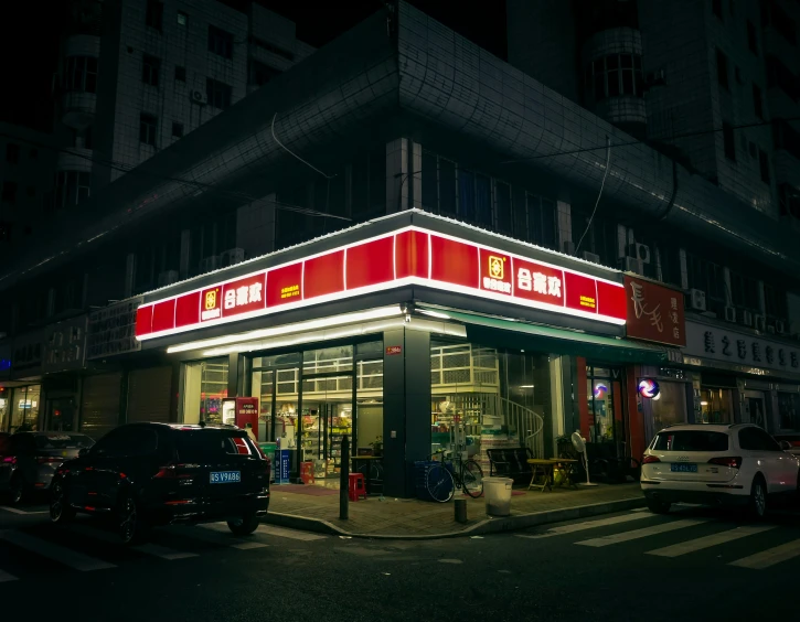 a gas station with some cars parked in front