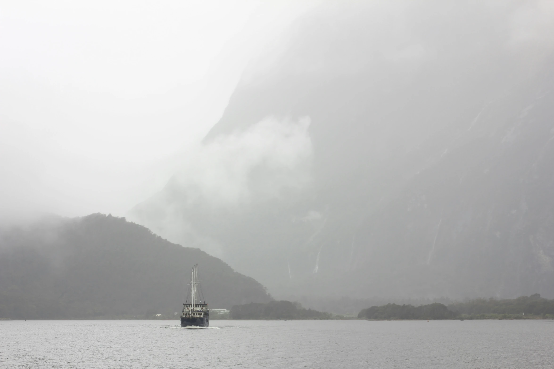 a boat is in the middle of a large body of water