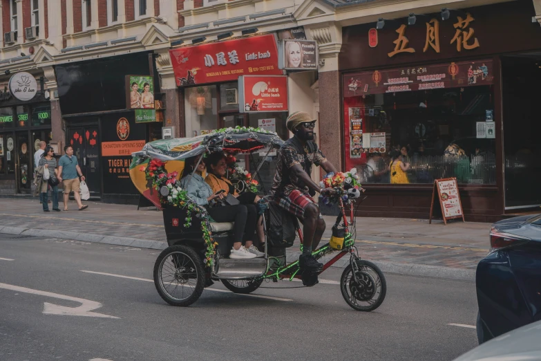 a group of people riding in the back of a horse drawn carriage