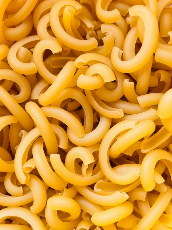 several noodles of different colors on top of each other