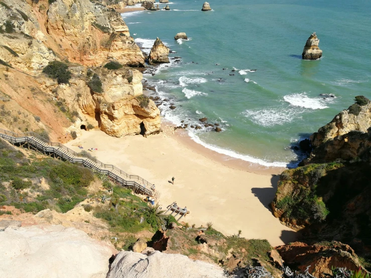 a beach and several cliffs along the water