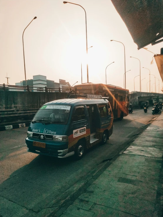 a van drives on the side of a road