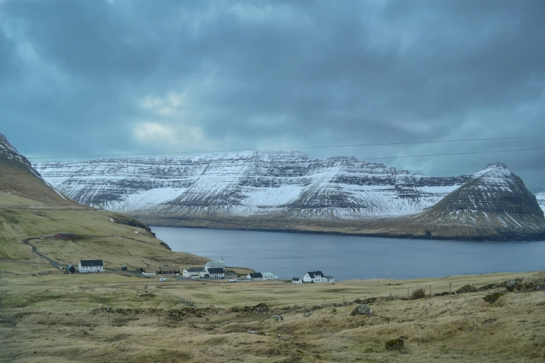 a field with a bunch of hills covered in snow