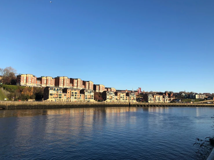 an image of a lake near some buildings