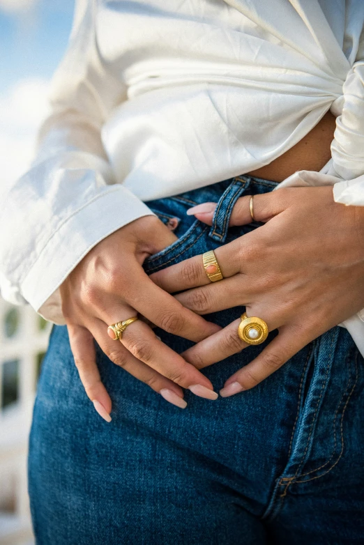 a woman wearing three different rings on her back