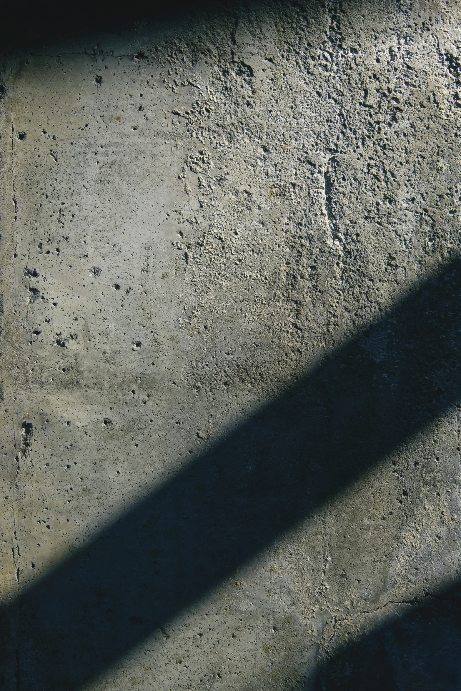 the shadow of a person's leg on the ground