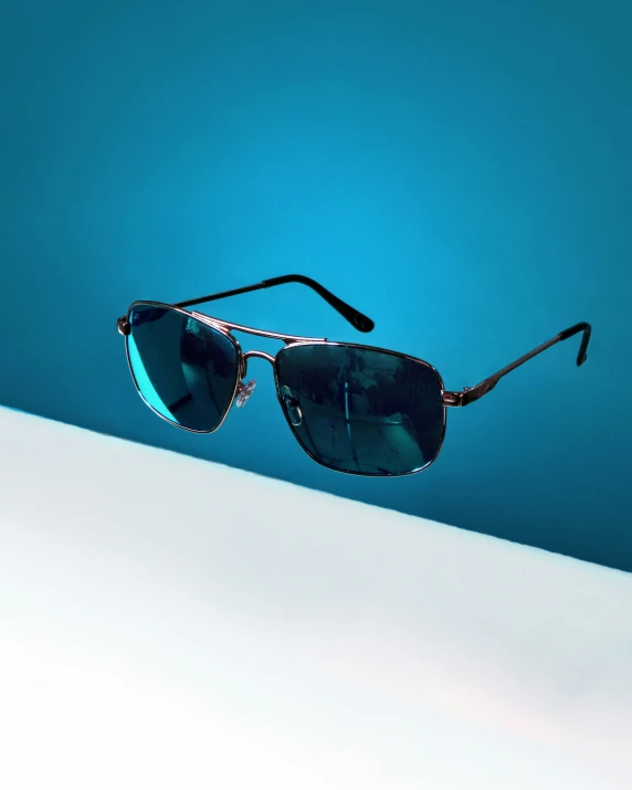 a pair of sunglasses is sitting on top of a counter