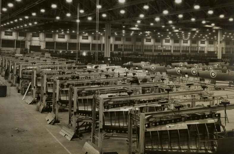 a warehouse filled with lots of tables and equipment
