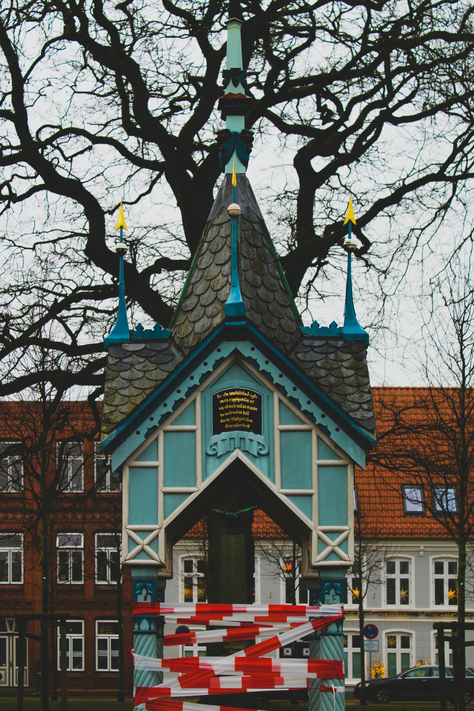 a building has been decorated with bright red and white stripes