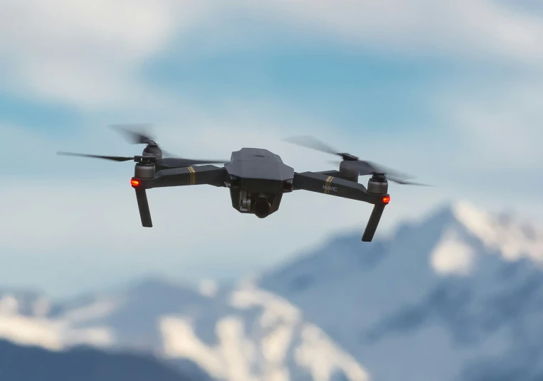 there is a black, small camera - controlled flying object