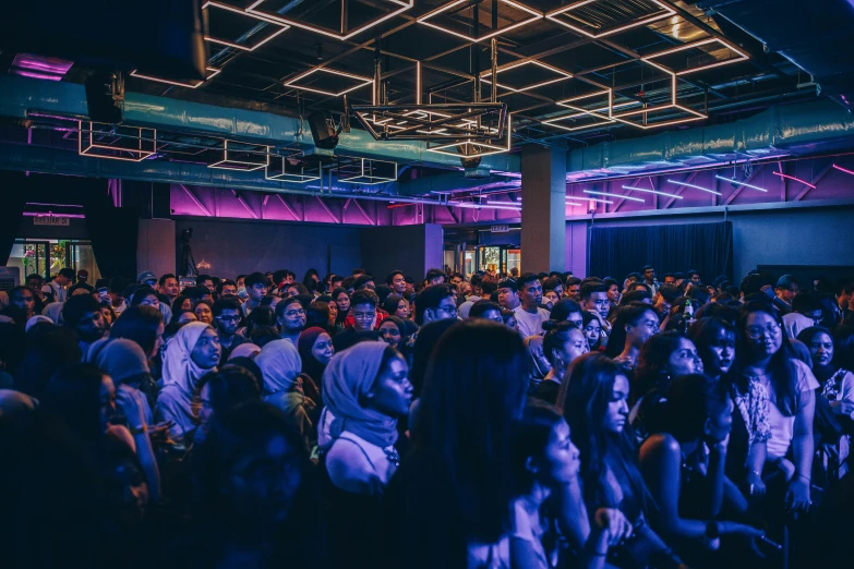 a crowd of people that are sitting down