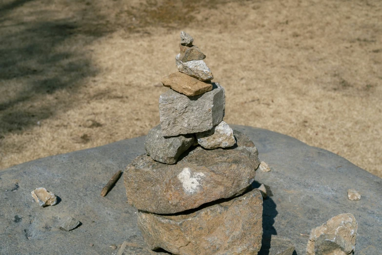 a pile of rocks sitting on top of a beach