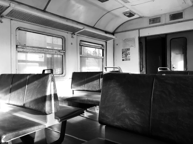 black and white pograph of train seating and windows