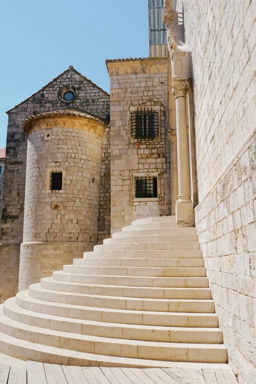this image is of stairs on the side of an old castle