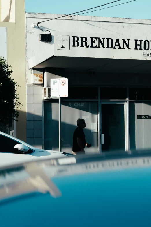 a man walks out of an empty building