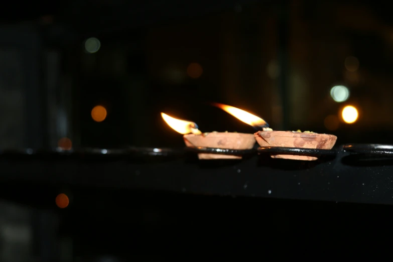 the lights are reflecting off of some small, decorative objects