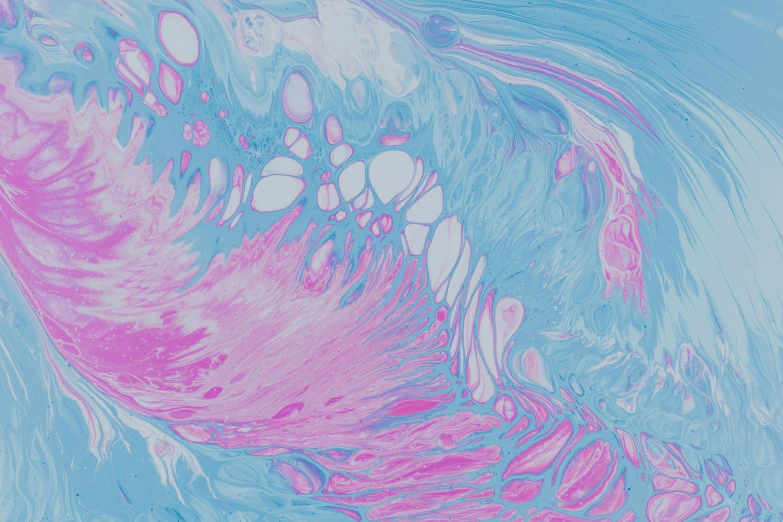 pink and blue fluid on a blue paper