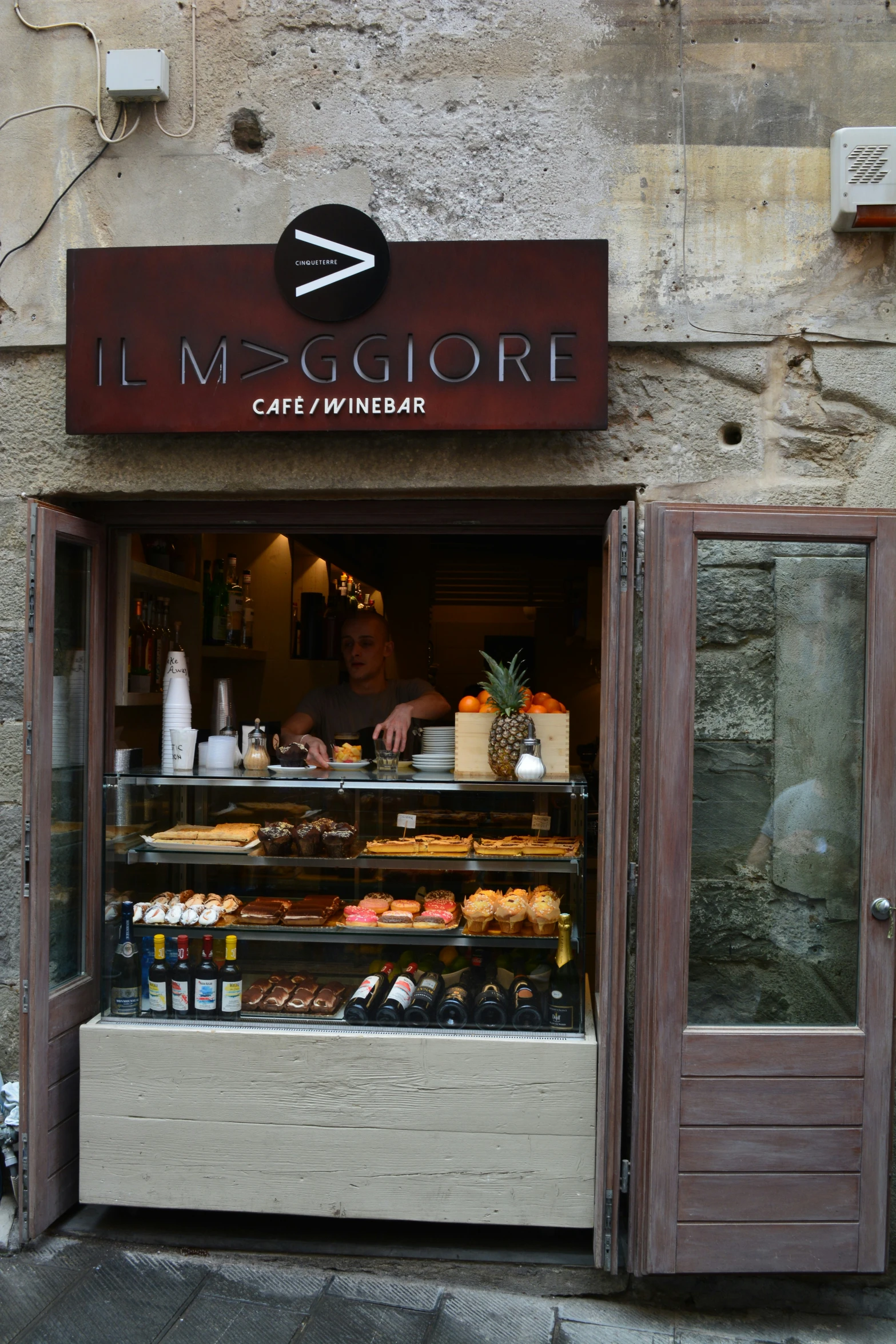 an italian bakery shop with lots of food inside