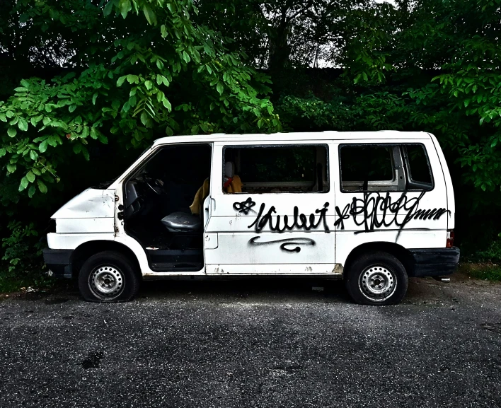 a van that has graffiti writing all over it