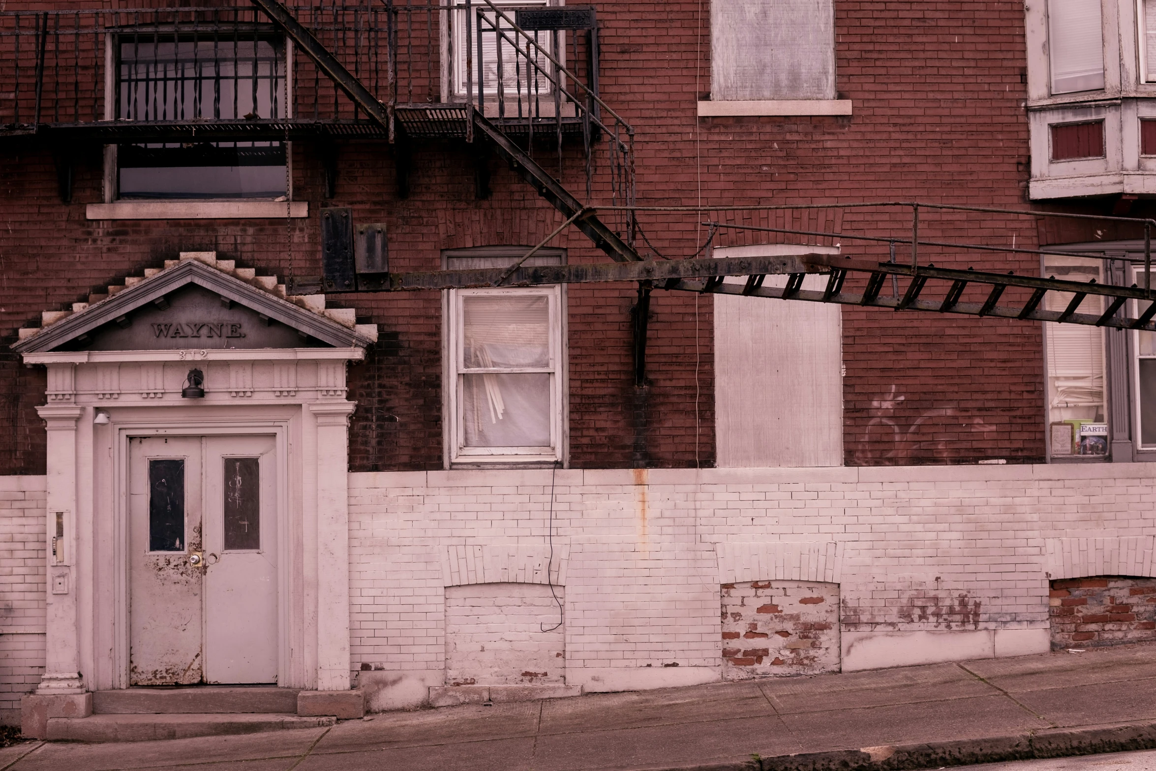 a small white door on an old building