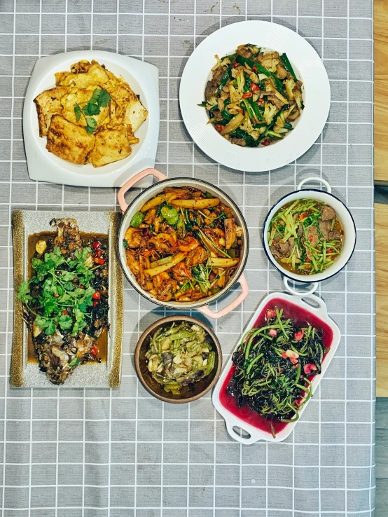 food is shown including rice, veggies and a meat dish
