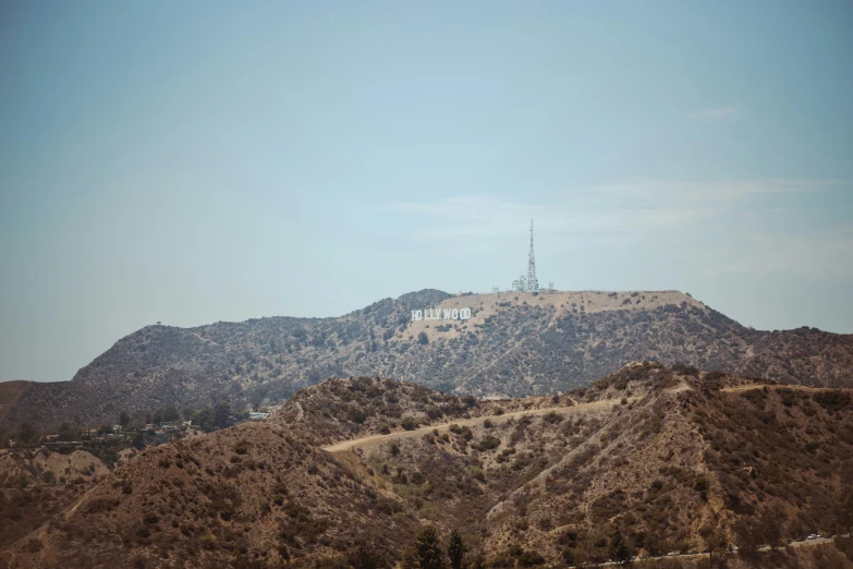 a picture of a small building sitting on top of a hill