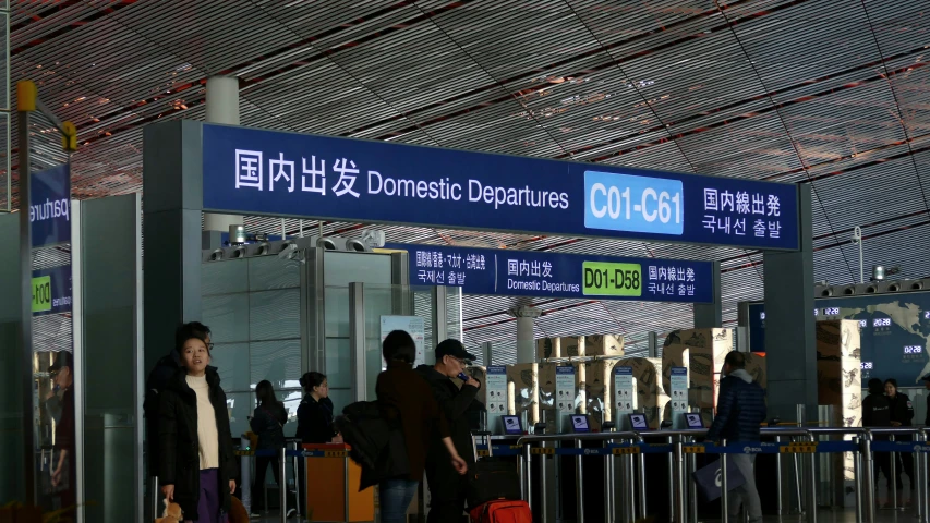 the people are waiting in the airport for their flight